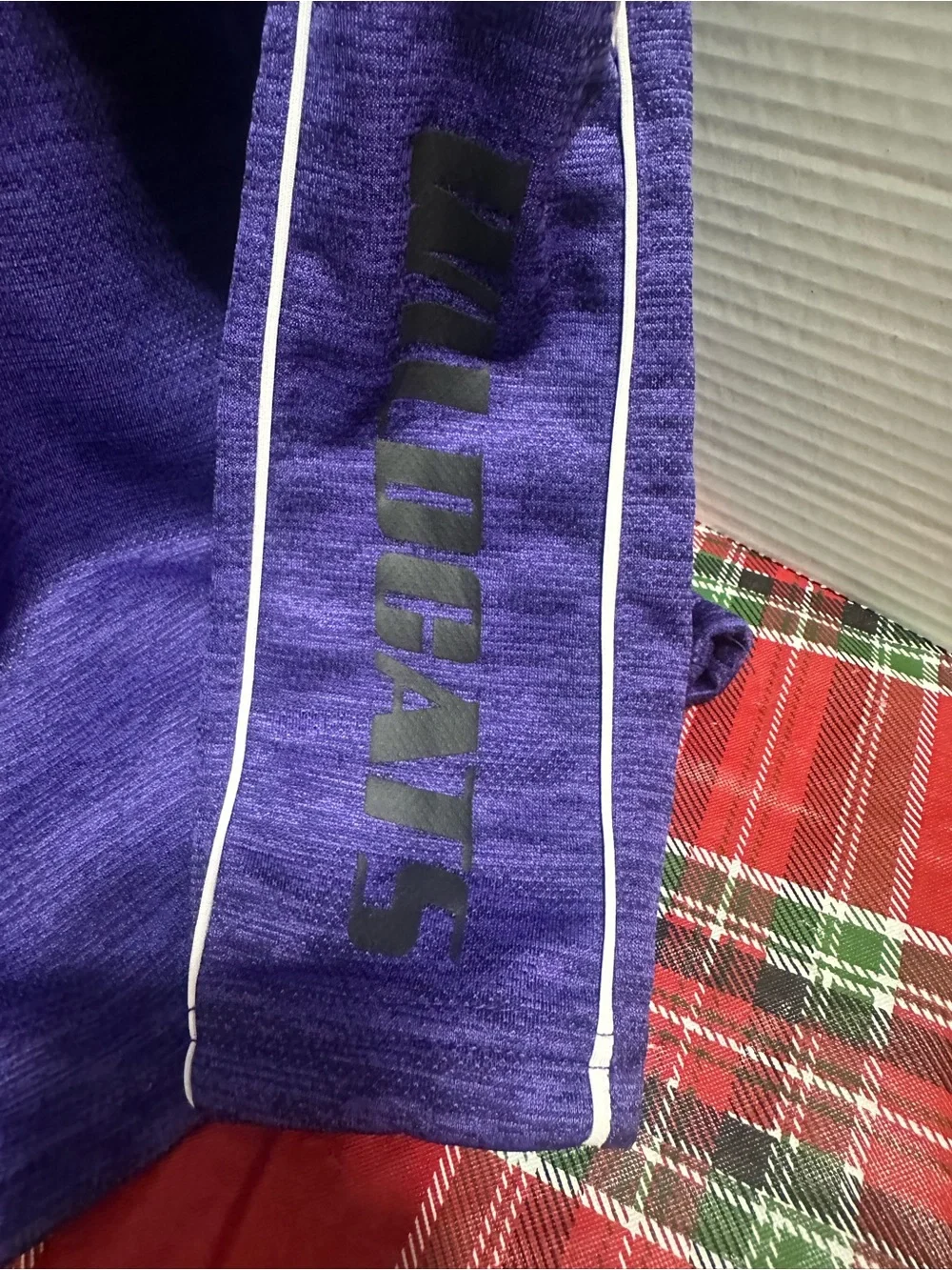 Two K-State Colosseum Youth XL quarter zips.